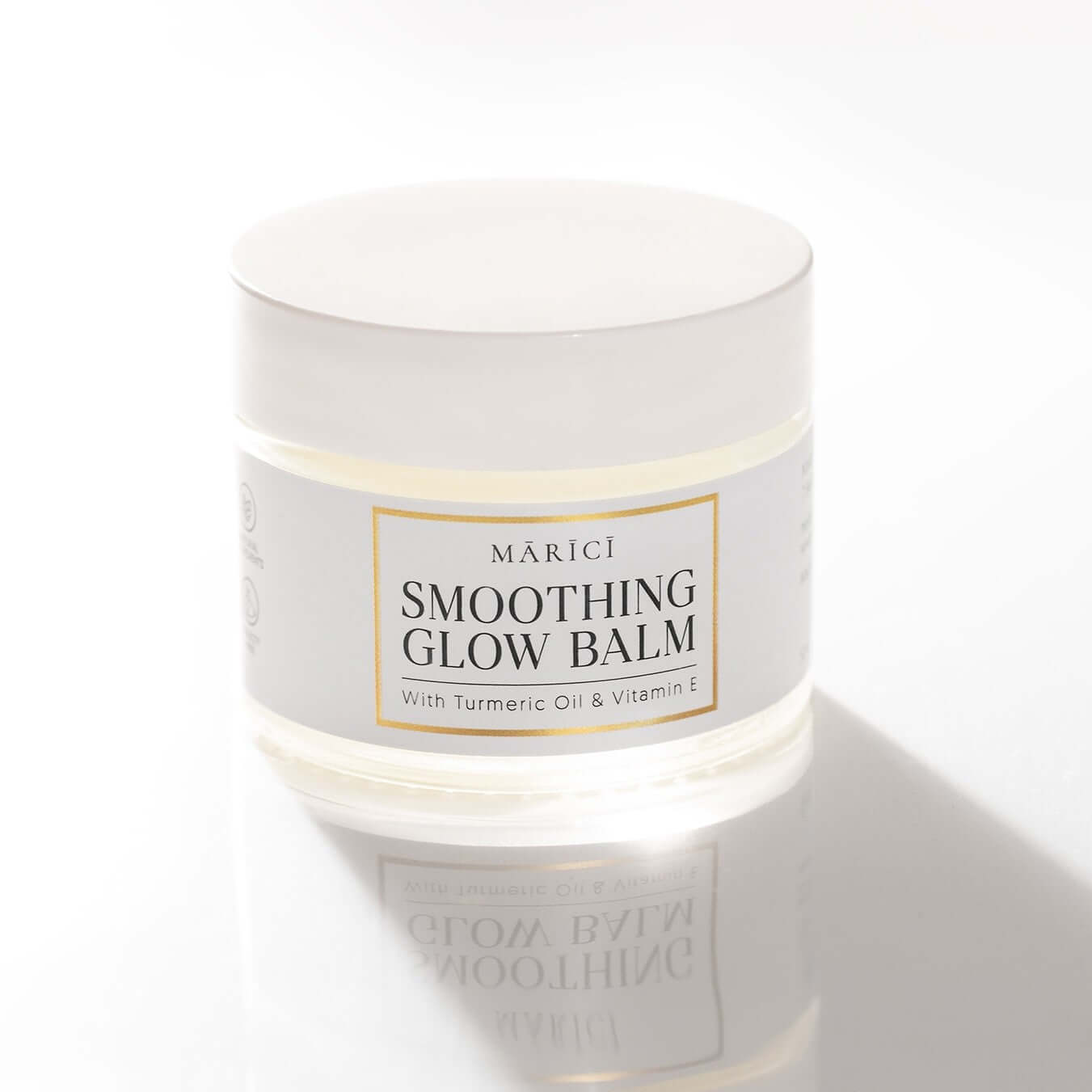 Multipurpose Smoothing Glow Balm with turmeric oil and vitamin E in a stylish jar, ideal for repairing dry skin.